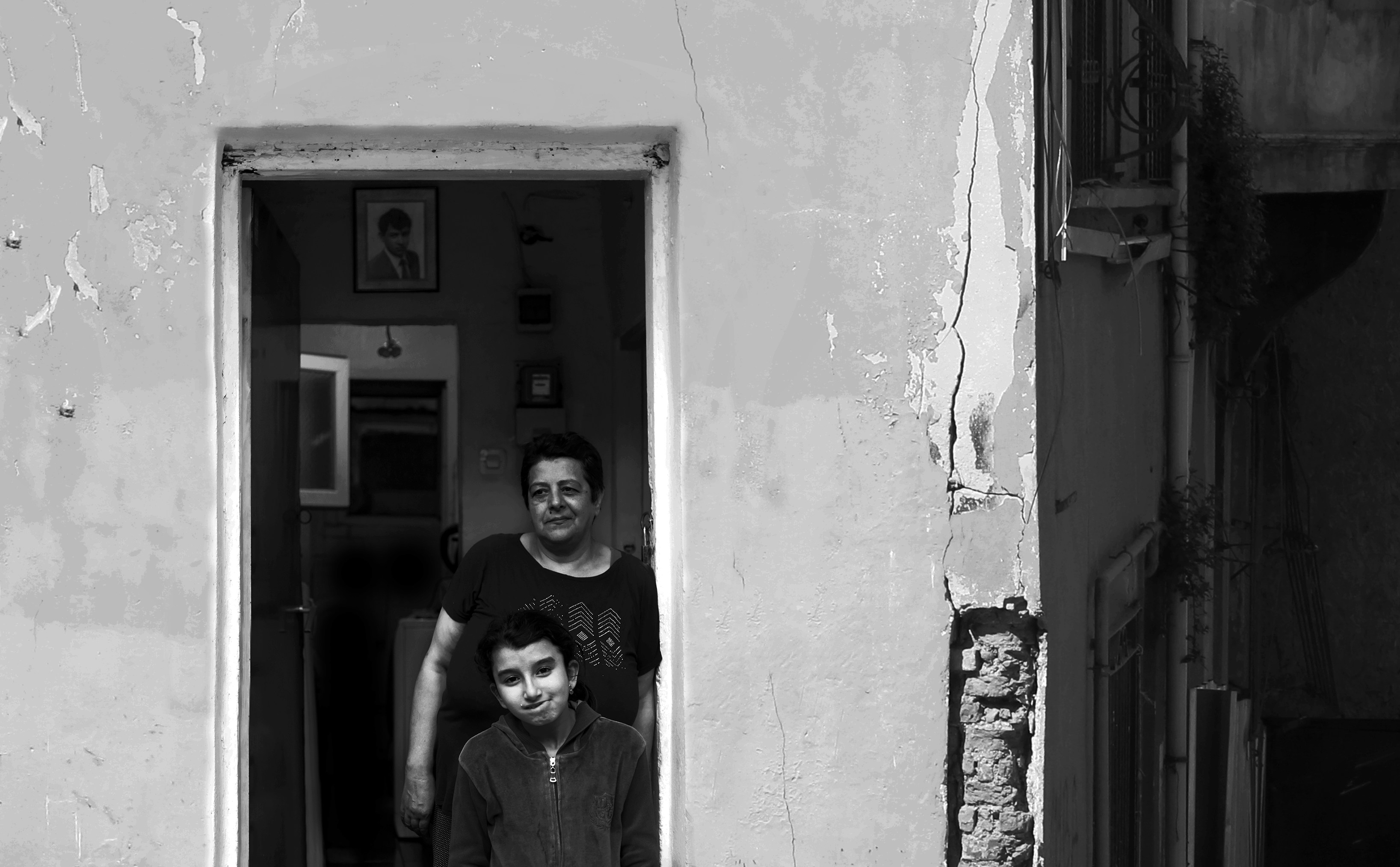 woman in black shirt standing beside door