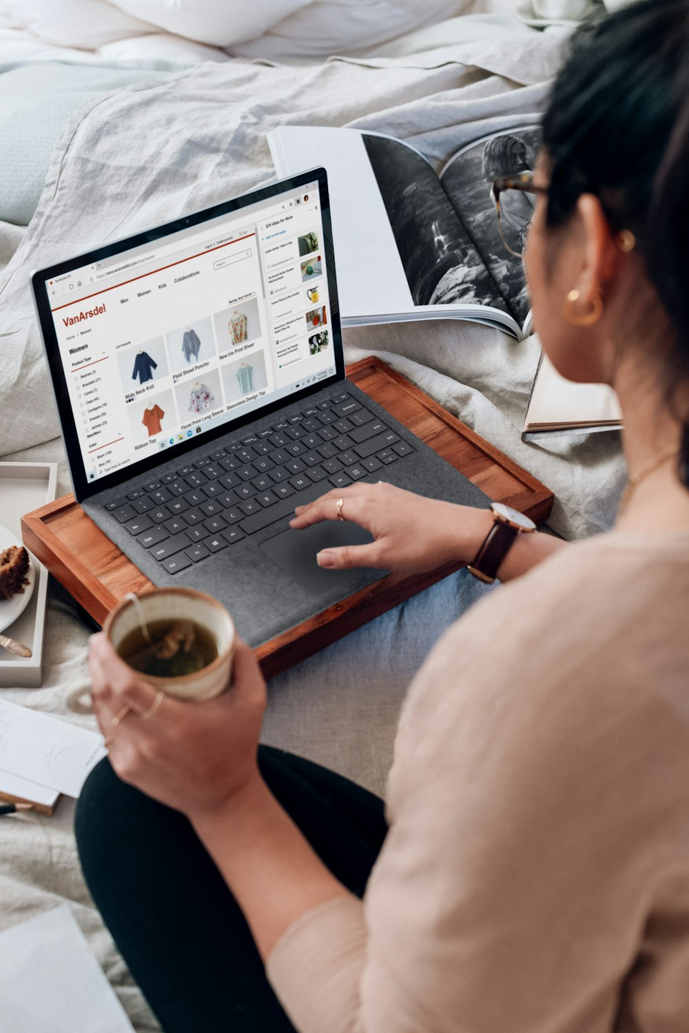 woman in white shirt using black laptop computer