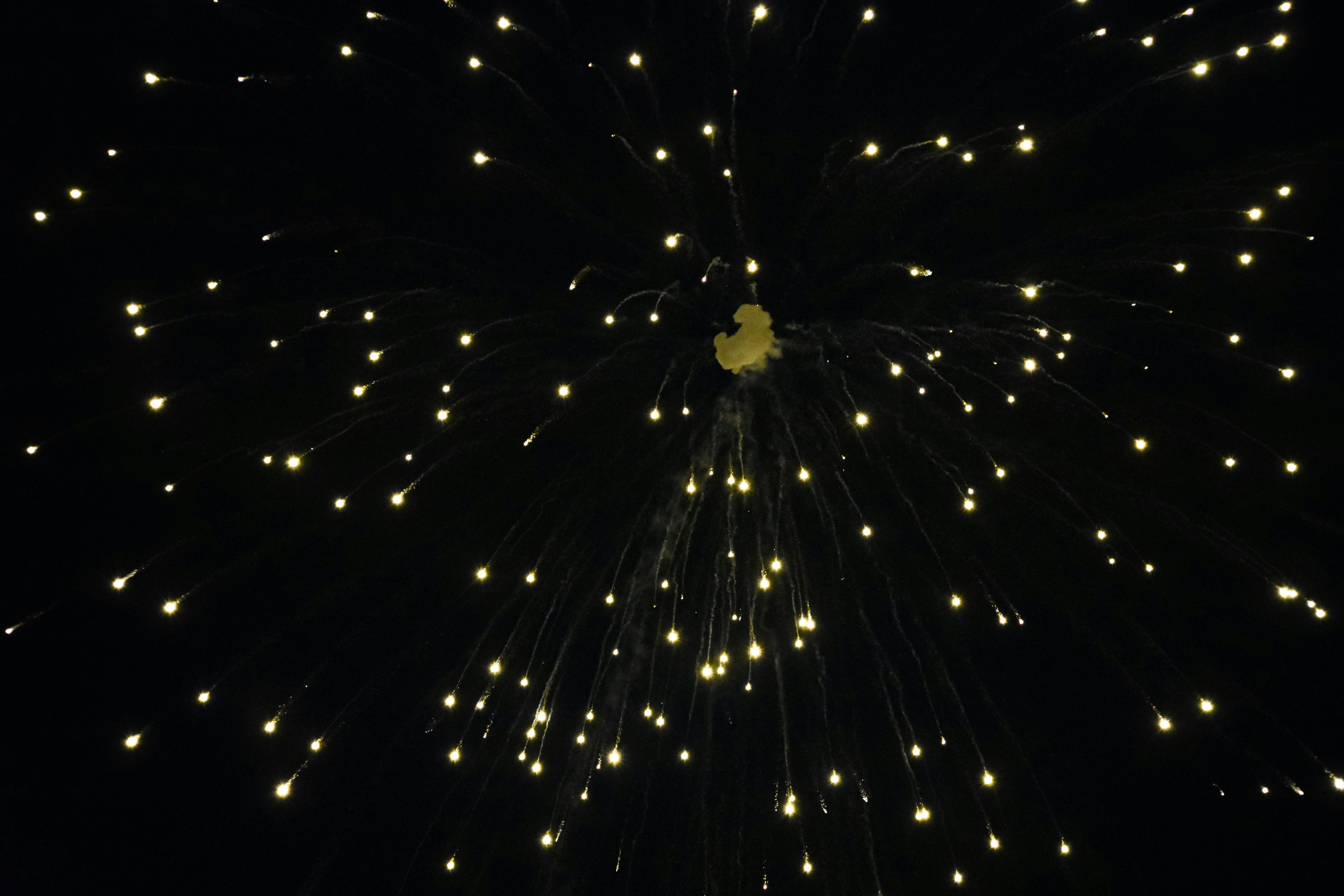 A fire cracker illuminating the night sky during diwali