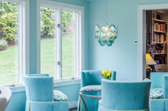 blue and gray padded armchairs