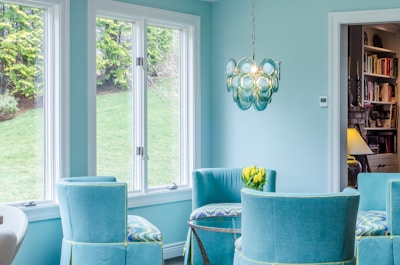 blue and gray padded armchairs