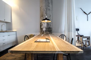 brown wooden table with chairs