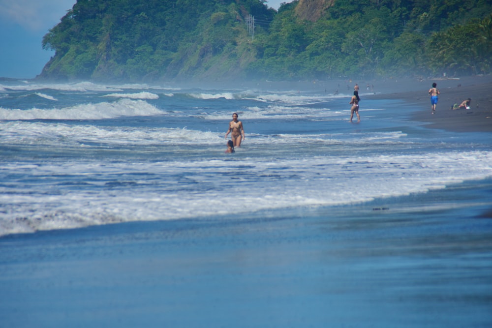 2 women in beach during daytime