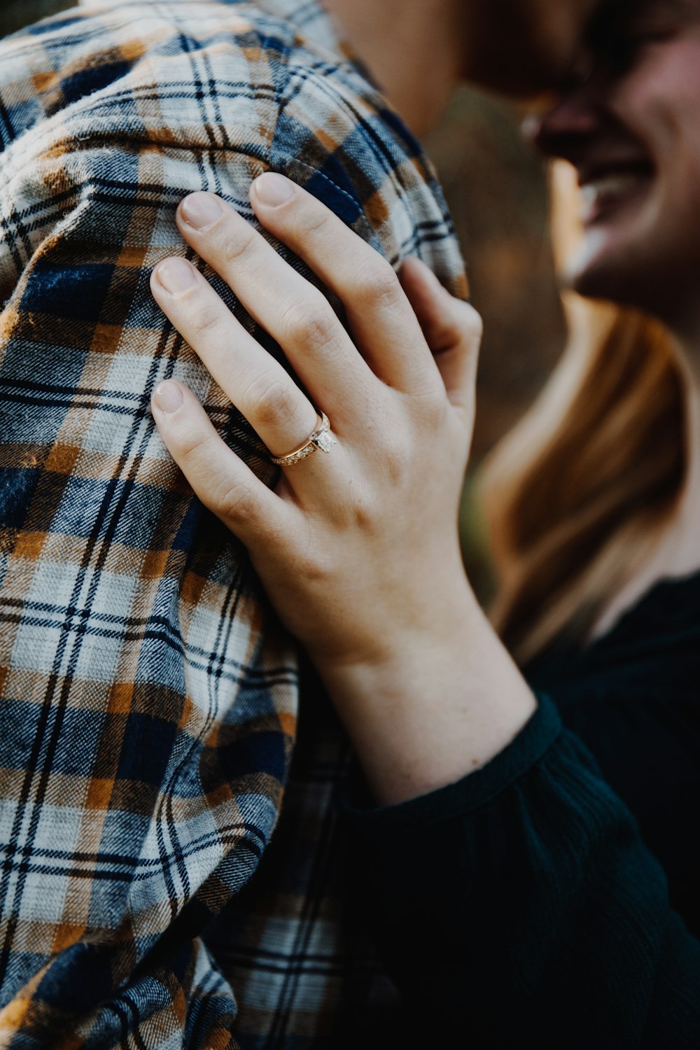 person in black long sleeve shirt wearing silver ring