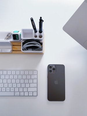 Modern tech accessories and practical tools neatly organized on a clean desk.