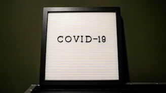 a picture frame with the word covidd - 19 written on it