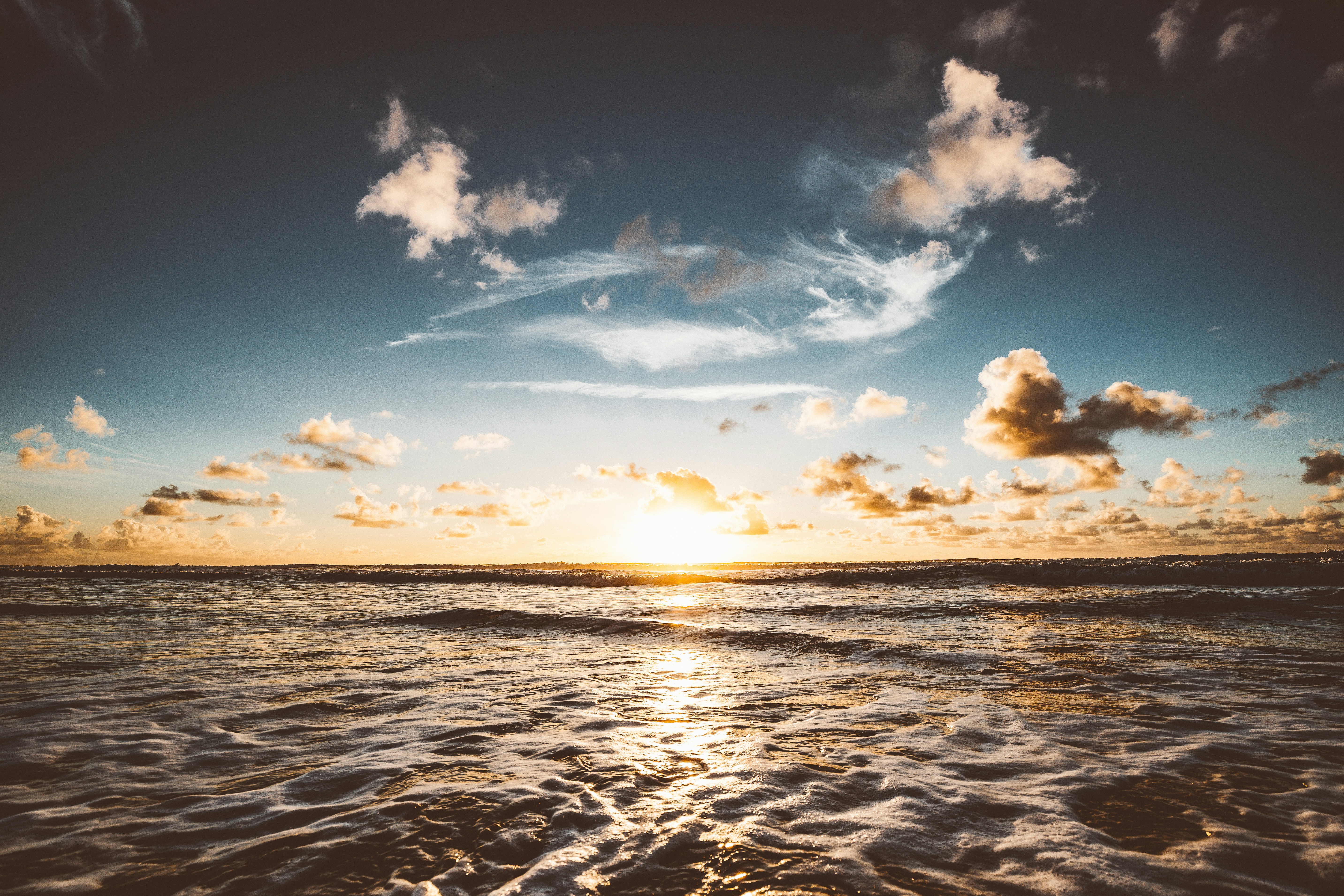 body-of-water-under-blue-sky-and-white-clouds-during-daytime