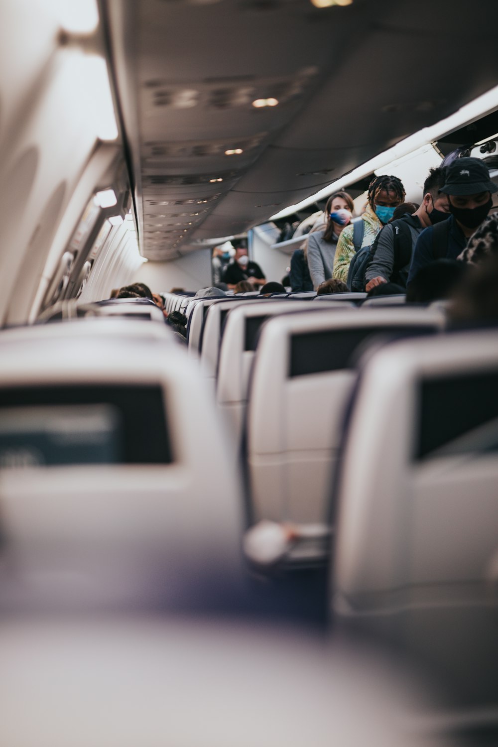 people sitting on airplane seats