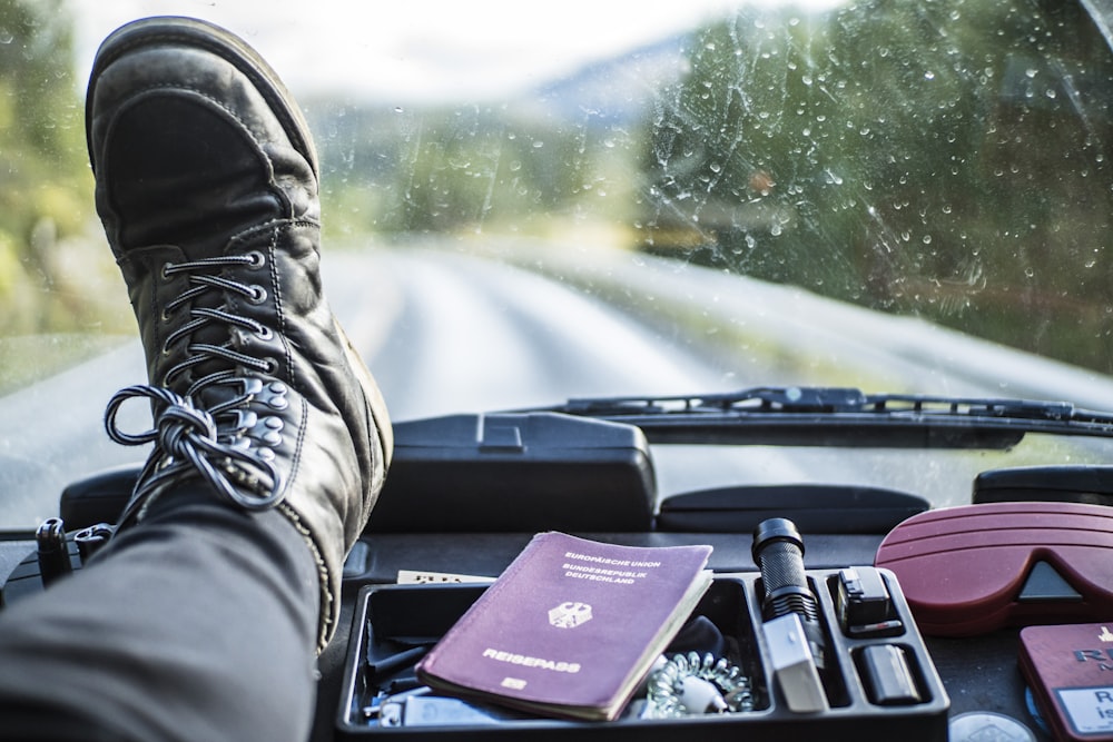 person in black leather boots