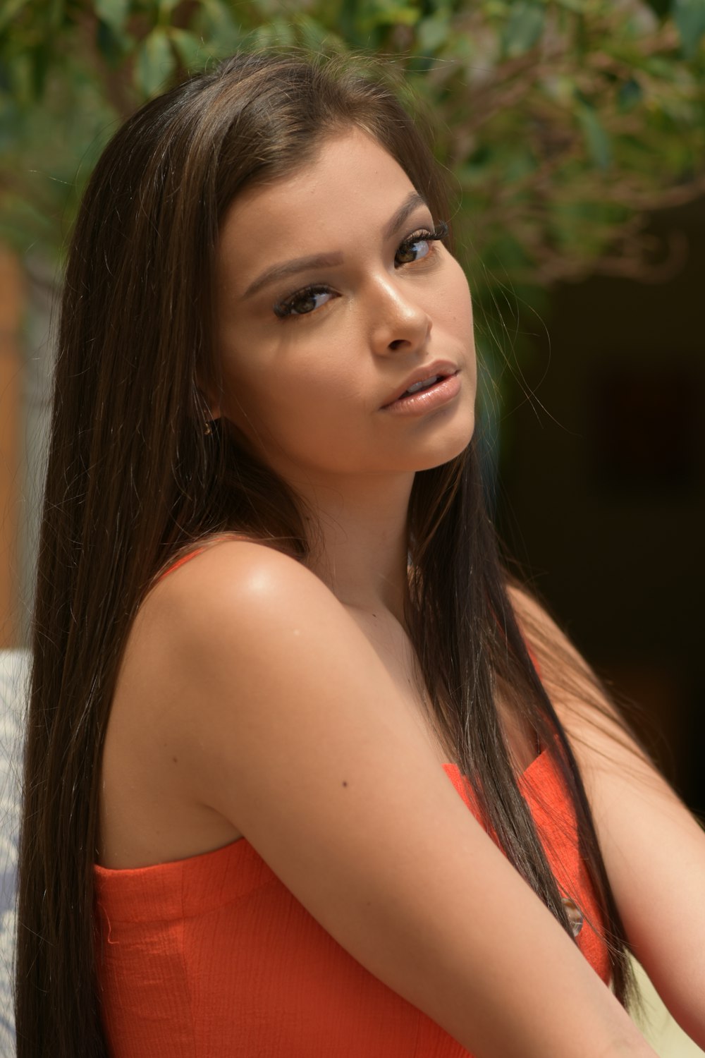 woman in orange tank top