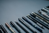 blue and silver click pen