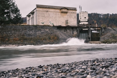 water falls near white concrete building during daytime