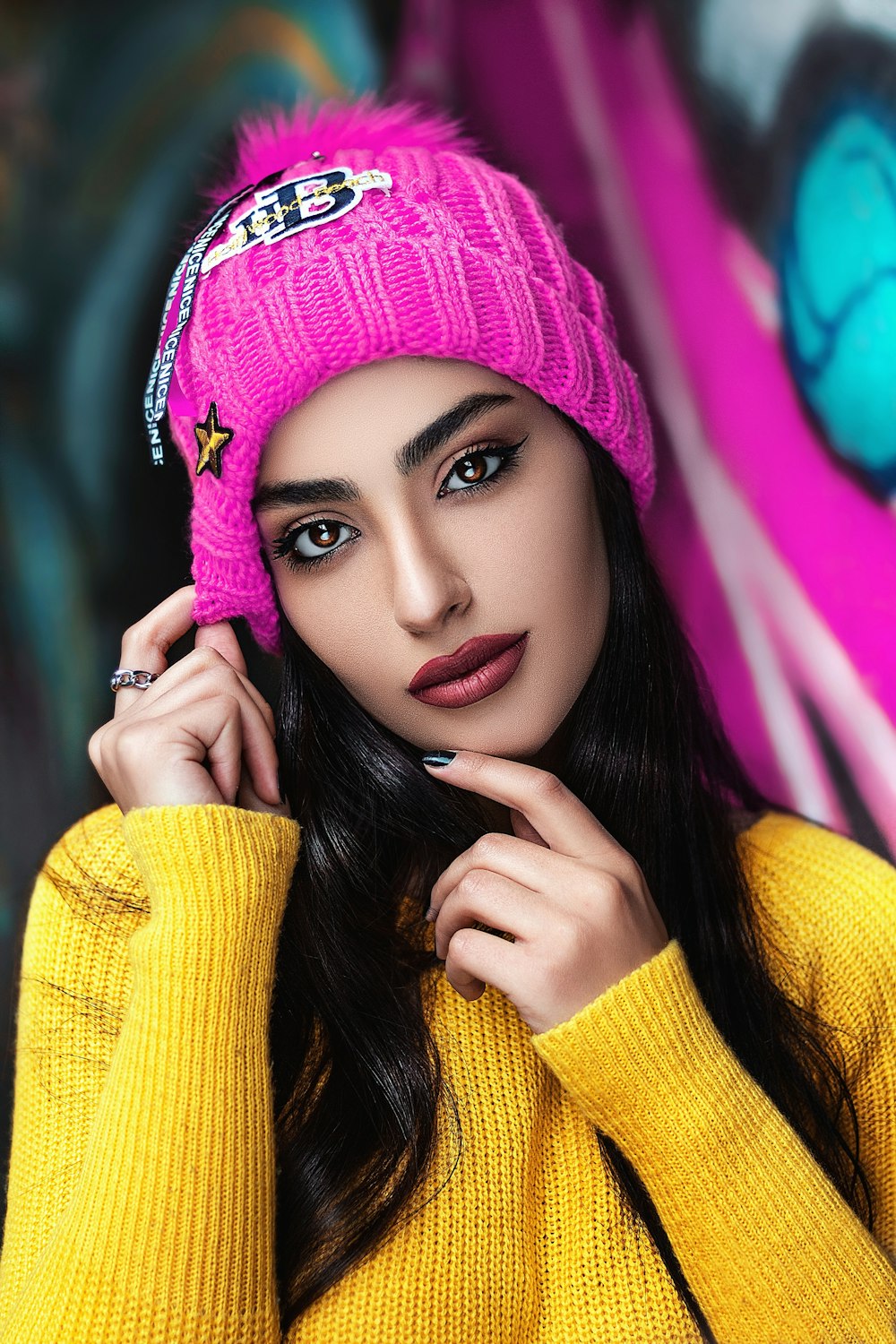 woman in yellow knit sweater and knit cap