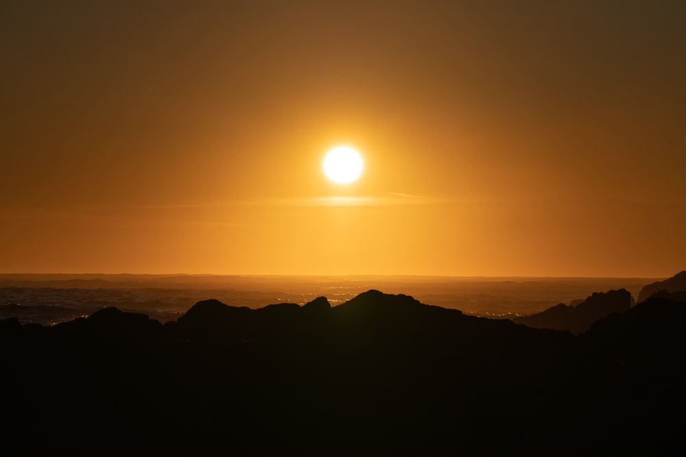 silhouette of mountain during sunset