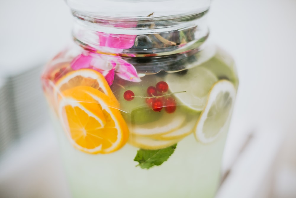 clear glass jar with yellow lemon