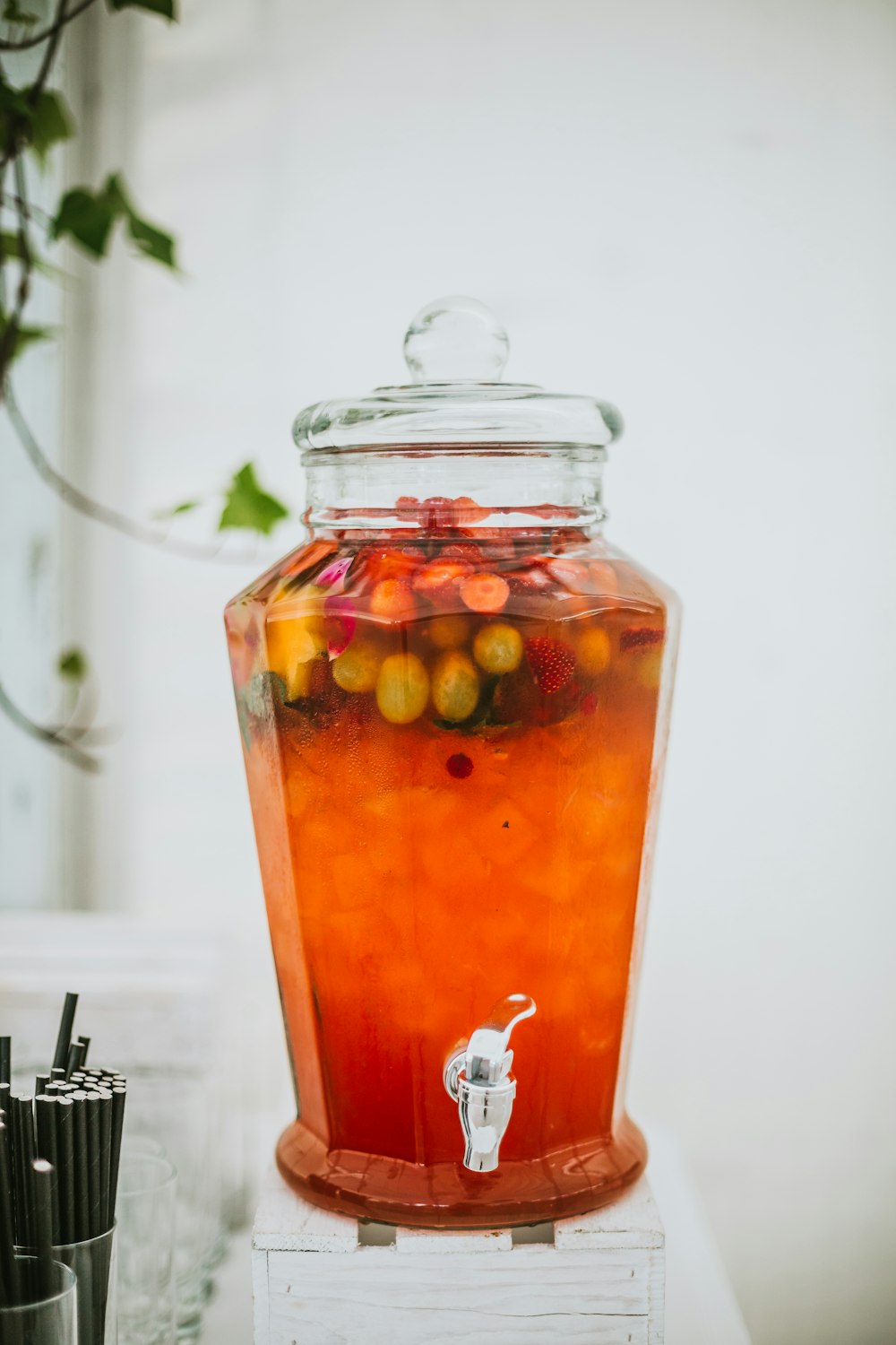 clear glass jar with orange liquid inside