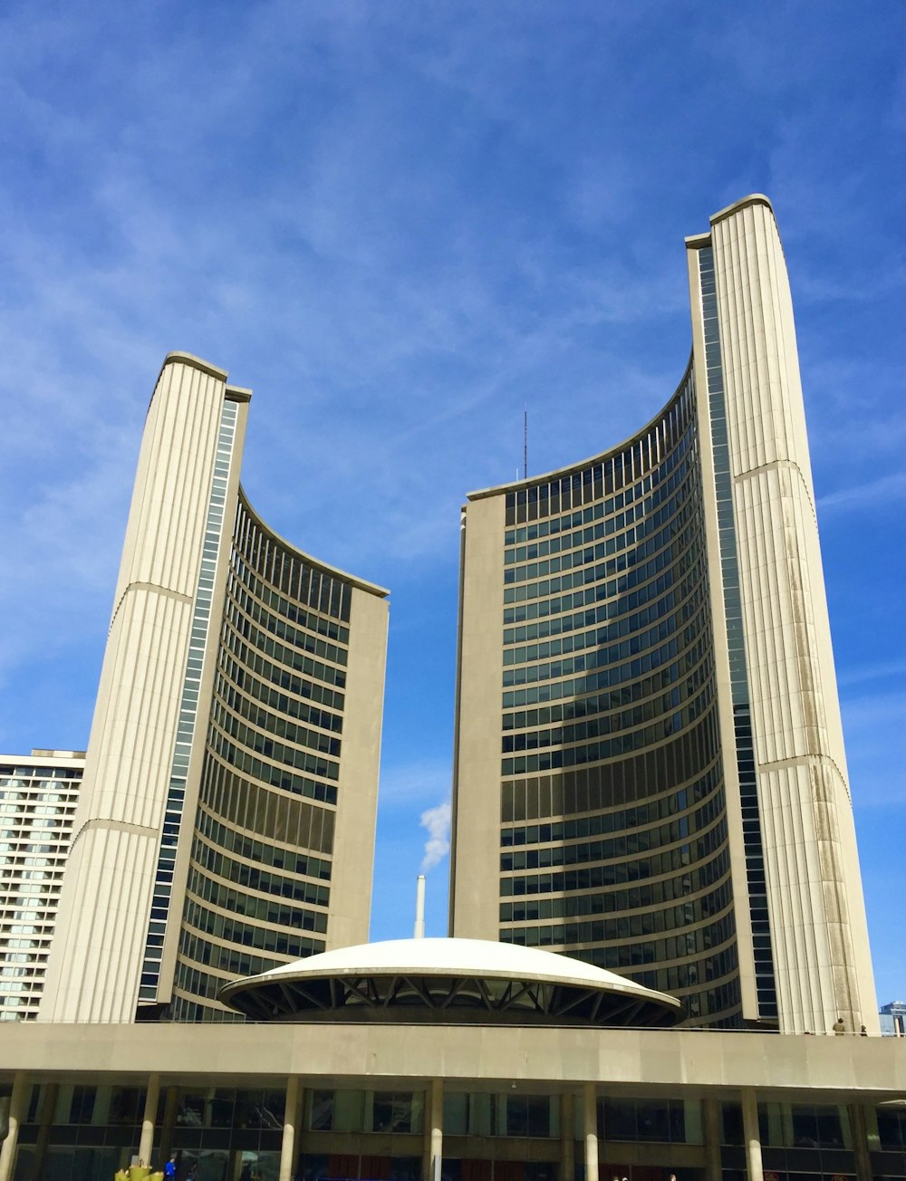 white and gray concrete building under blue sky during daytime