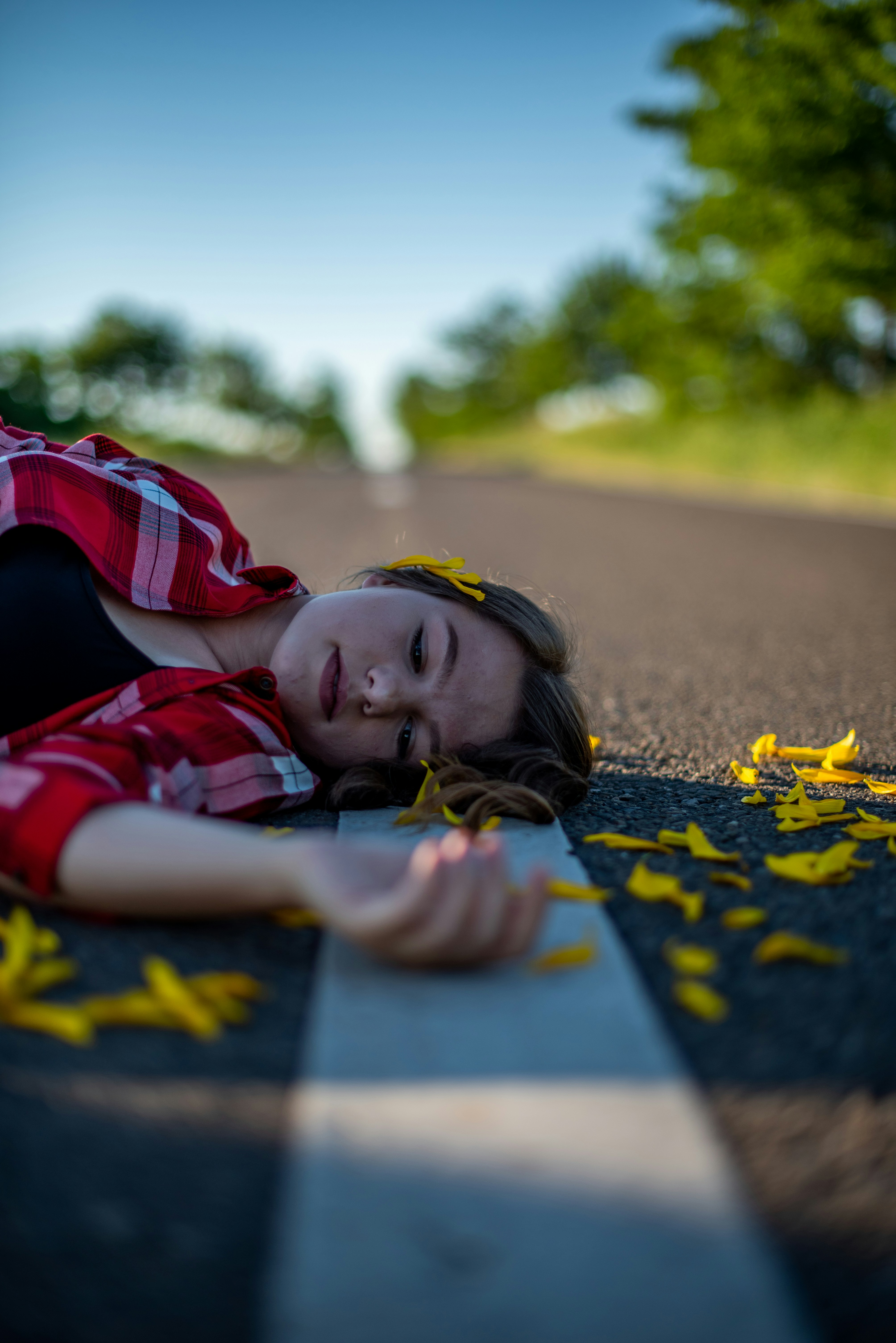 girl in red and white jacket lying on blue and yellow star print mat