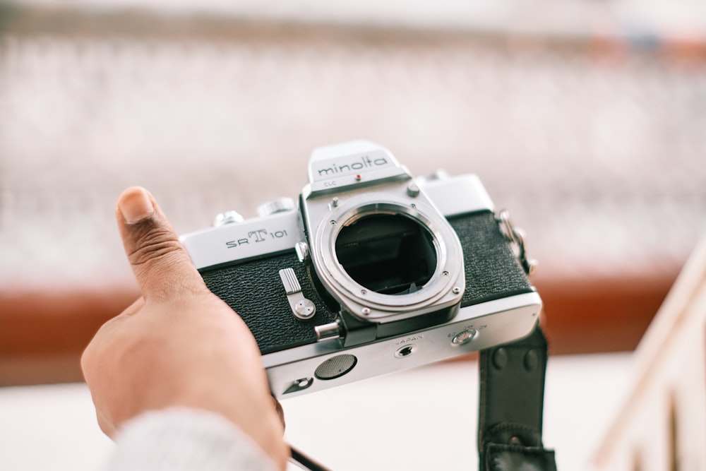 black and silver canon dslr camera