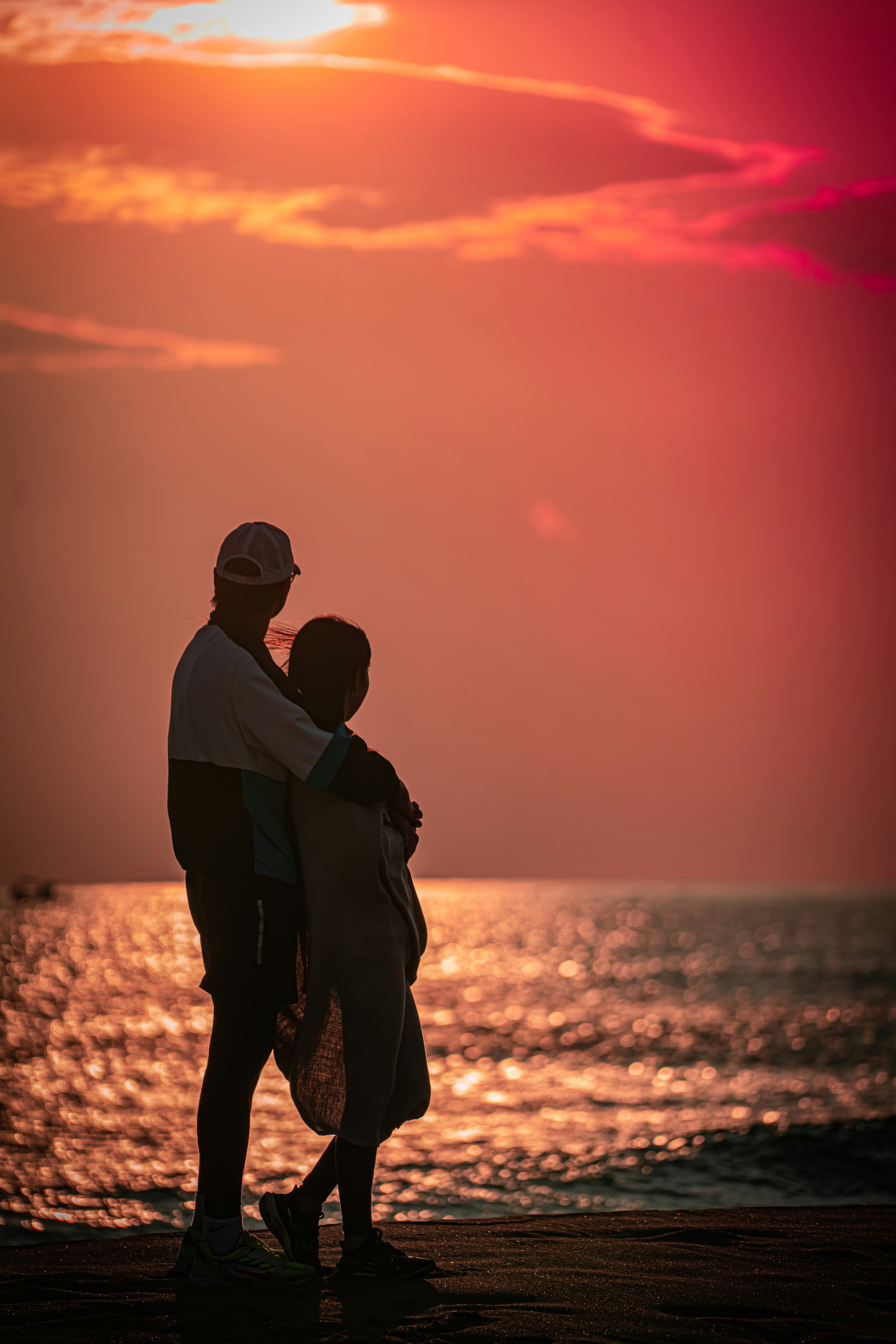 Couple enjoying a sunset at a beachside resort