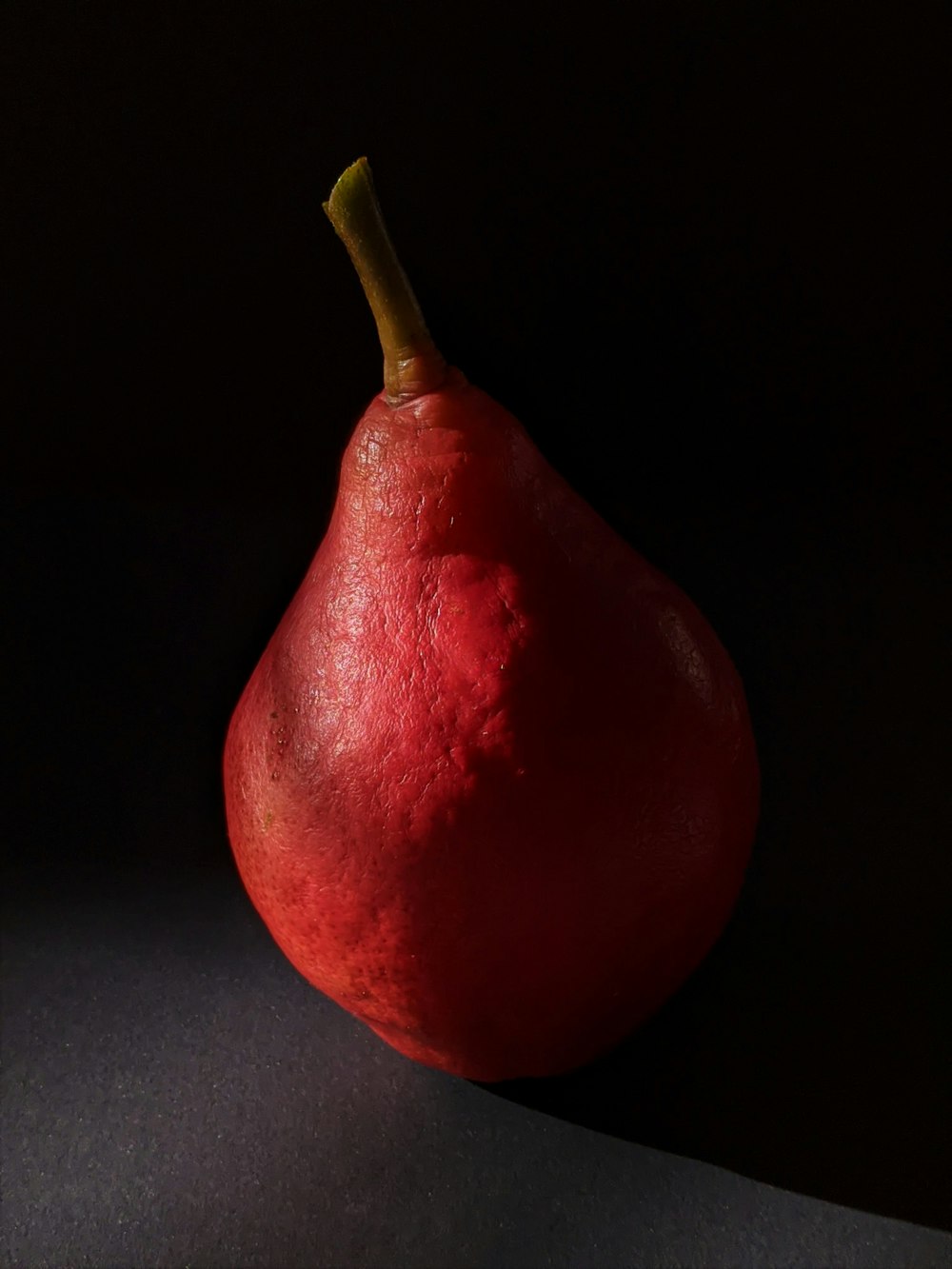 red fruit on black surface