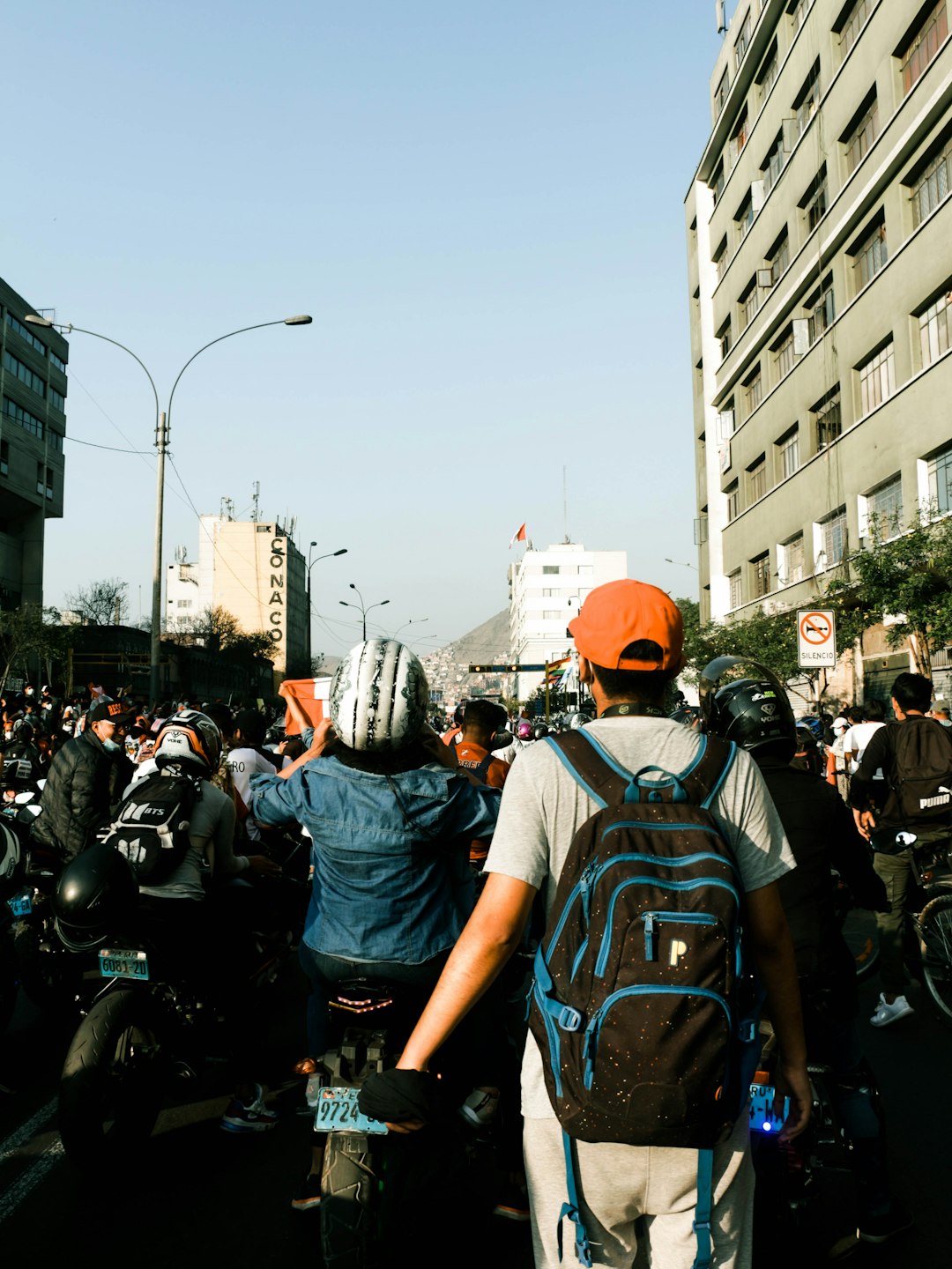 people riding motorcycle on road during daytime