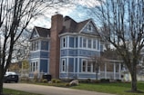 Exterior of a New Haven home showcasing a smooth, vibrant navy blue paint job on siding.