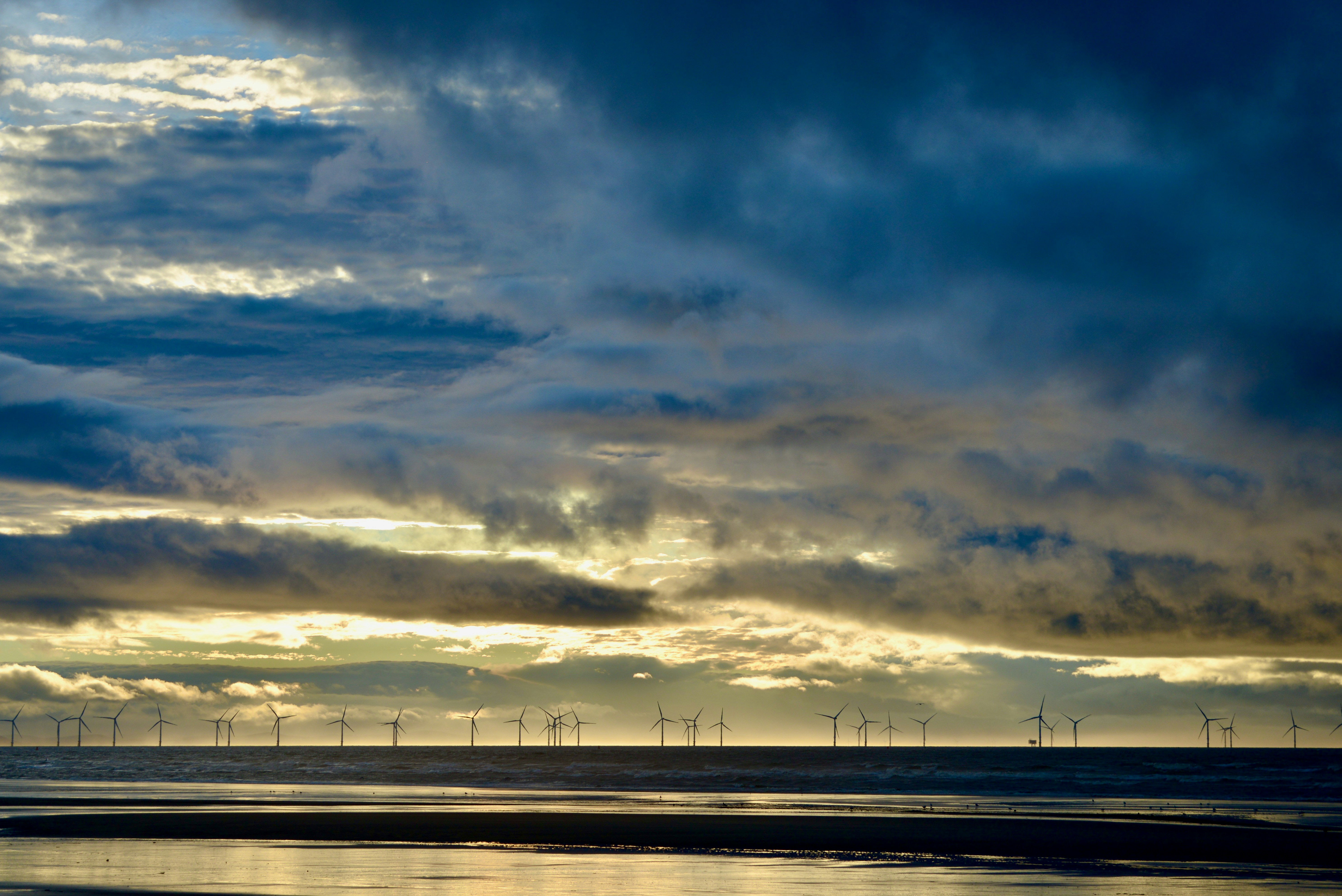 white clouds over the city during daytime