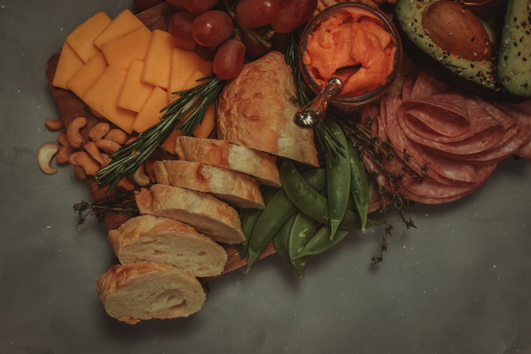 sliced bread with sliced tomatoes and green leaves