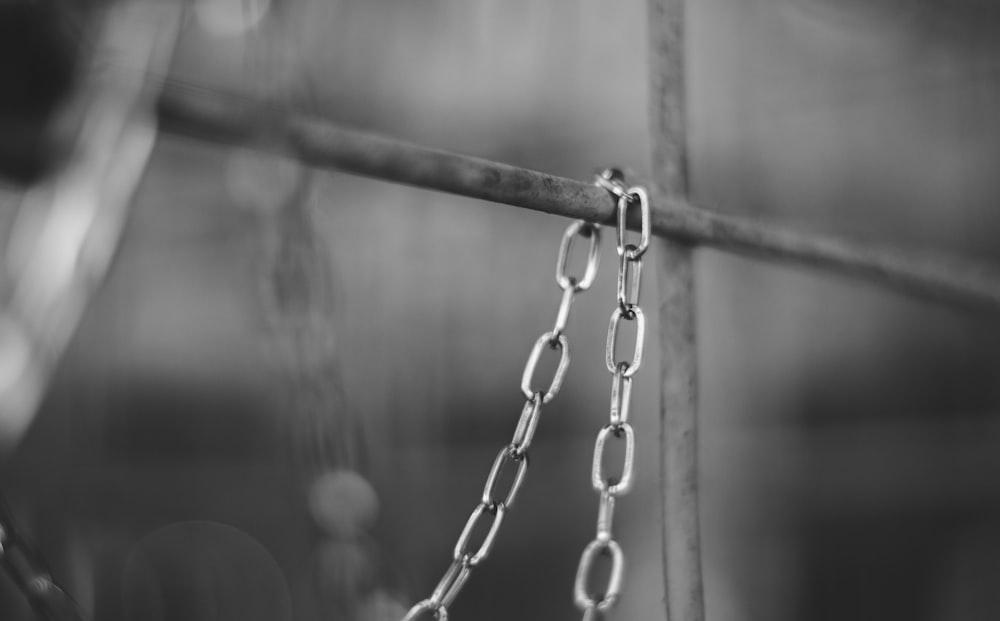 grayscale photo of chain link fence