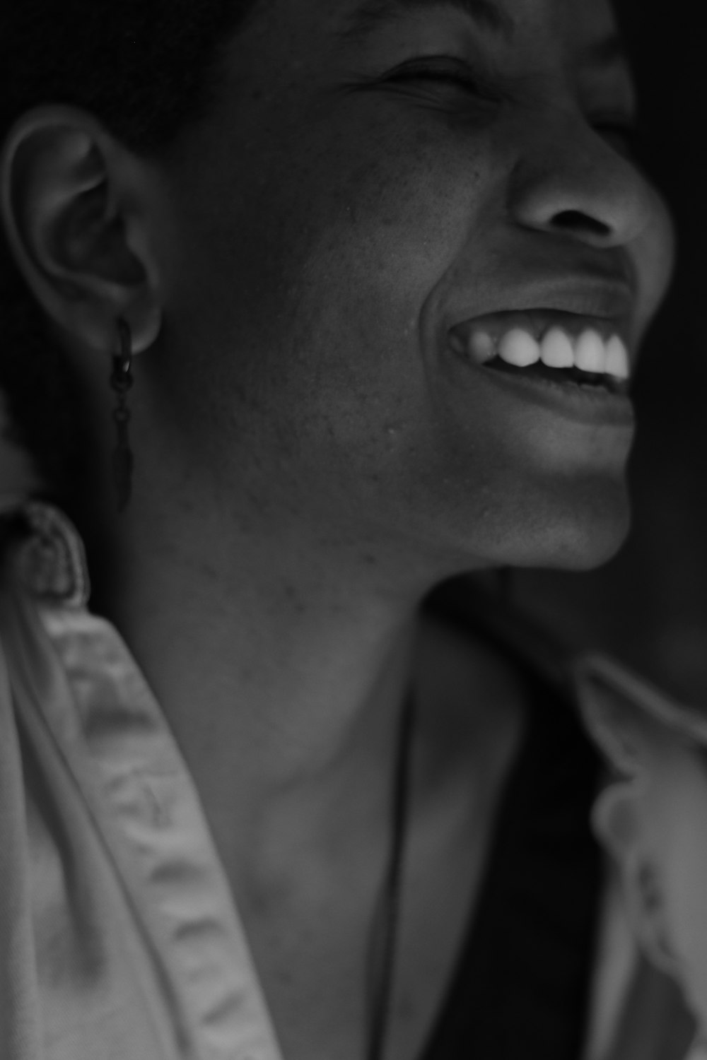 grayscale photo of smiling woman