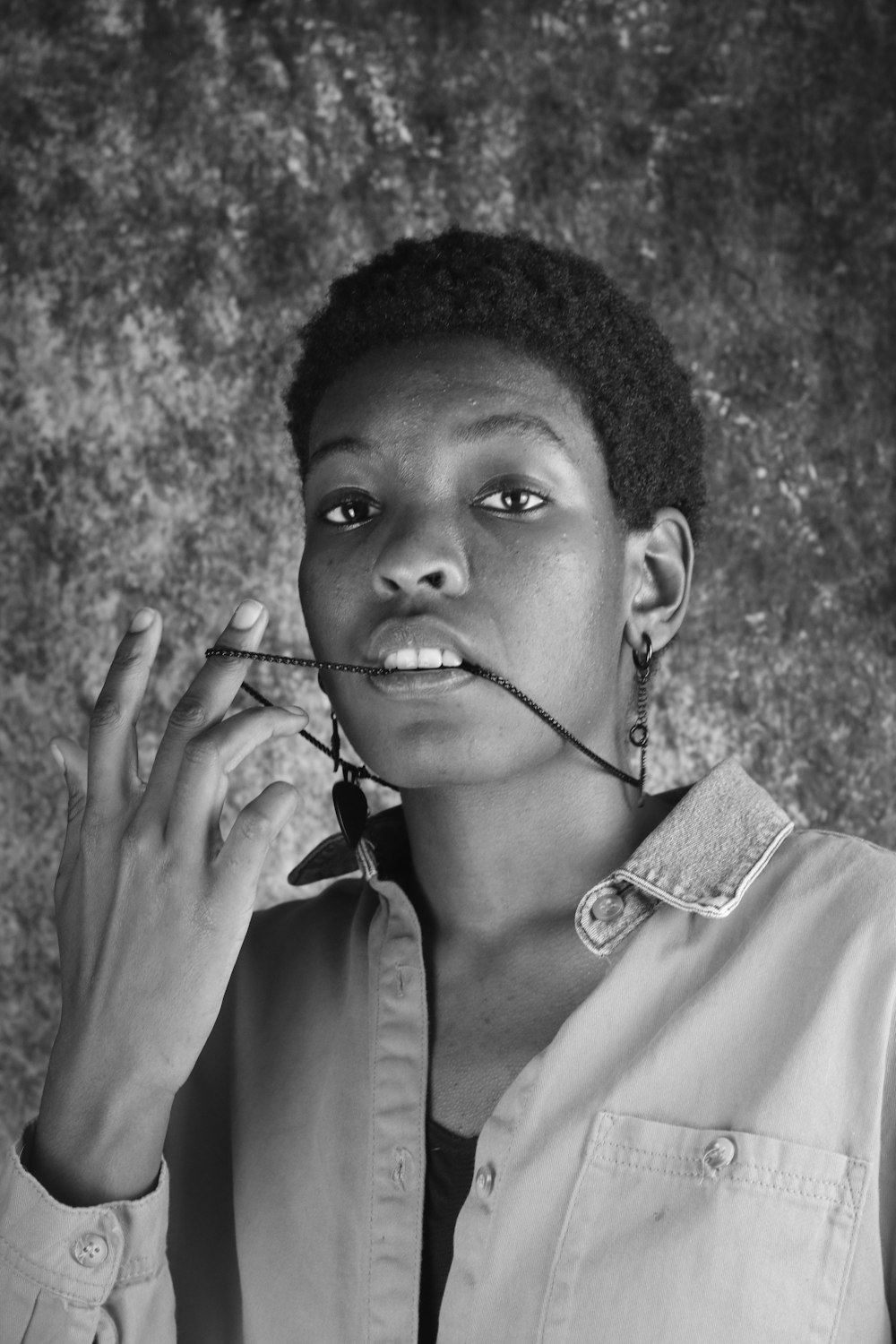 grayscale photo of woman in button up shirt