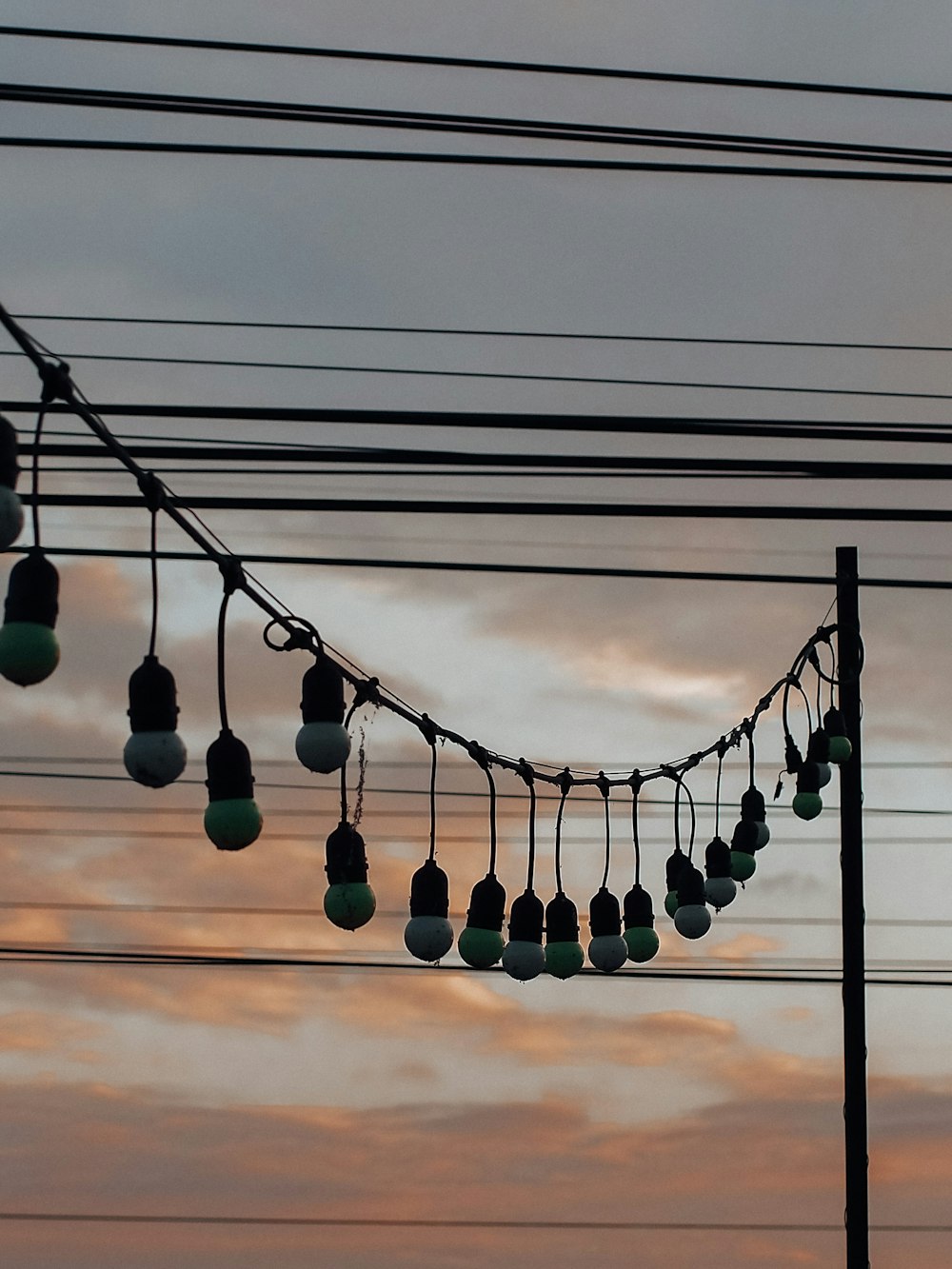 silhouette of light post during sunset