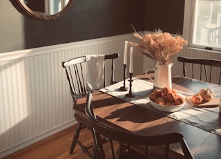 brown wooden table with chairs