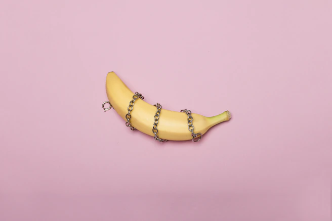 yellow banana on white surface