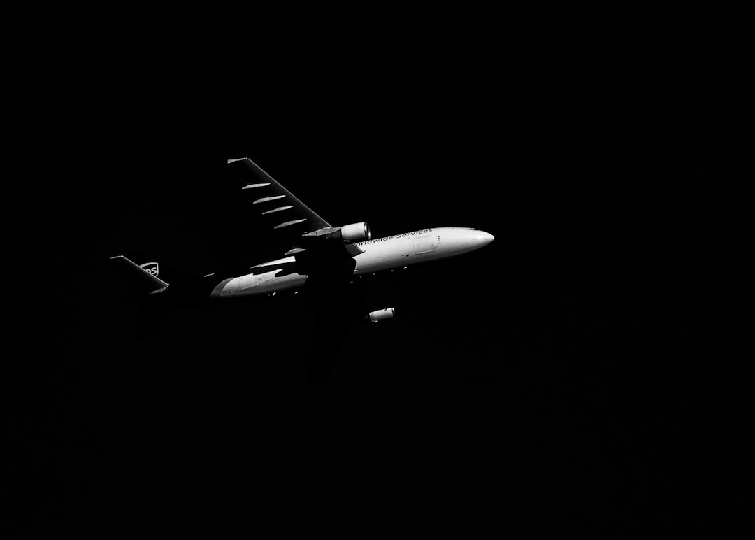 white airplane in black background