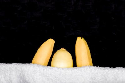 yellow banana on white towel