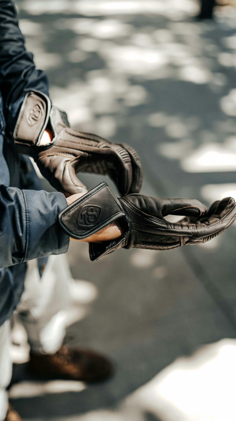 person in black leather boots