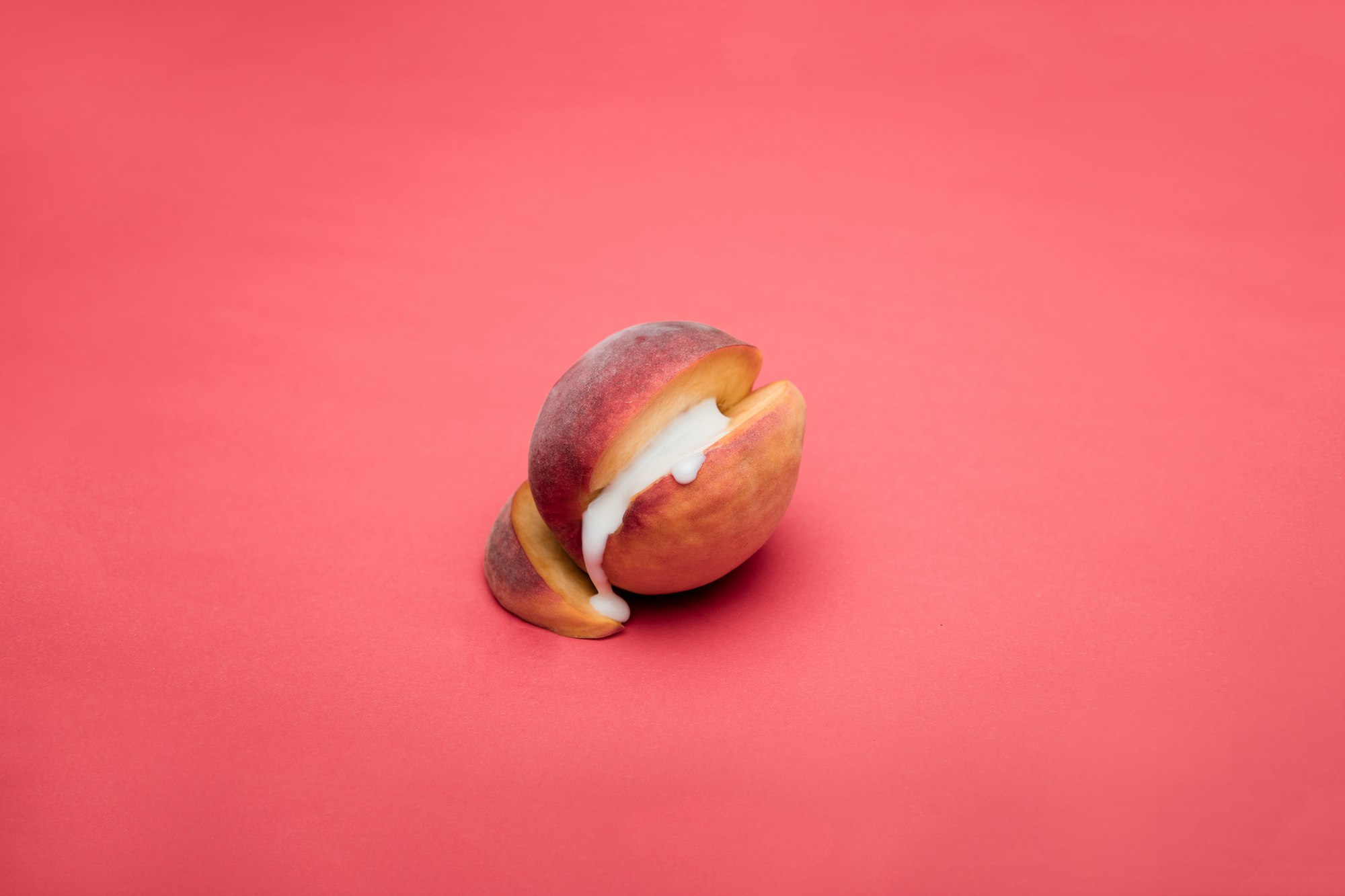 sliced apple fruit on pink surface