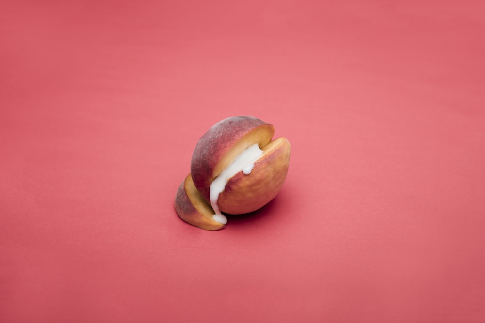 sliced apple fruit on pink surface