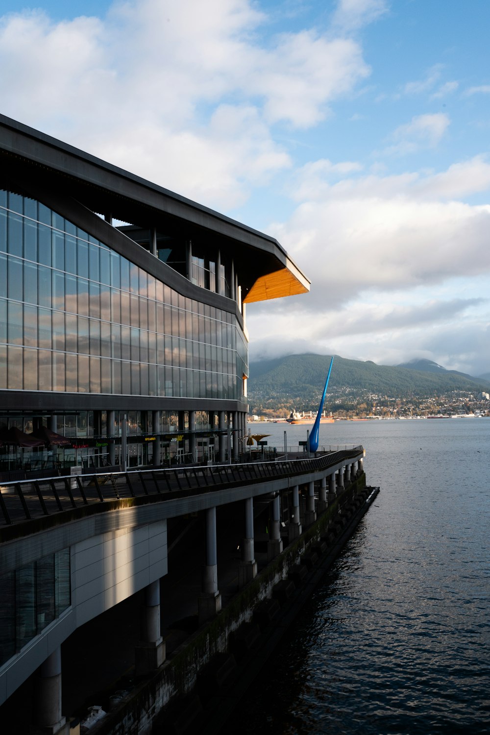 white and brown building near body of water during daytime