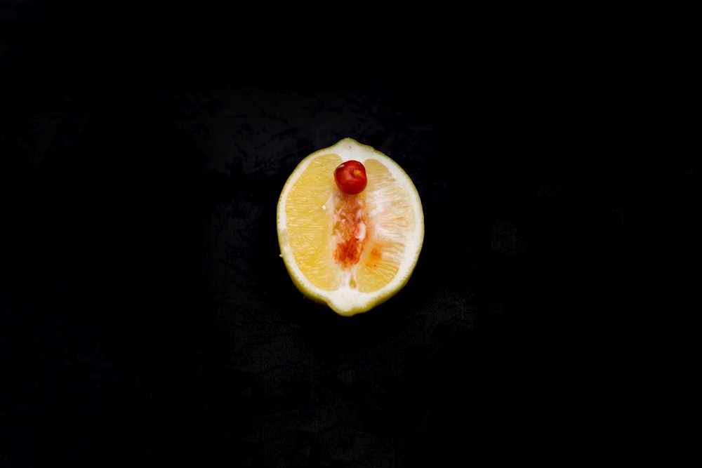 sliced fruit on black surface