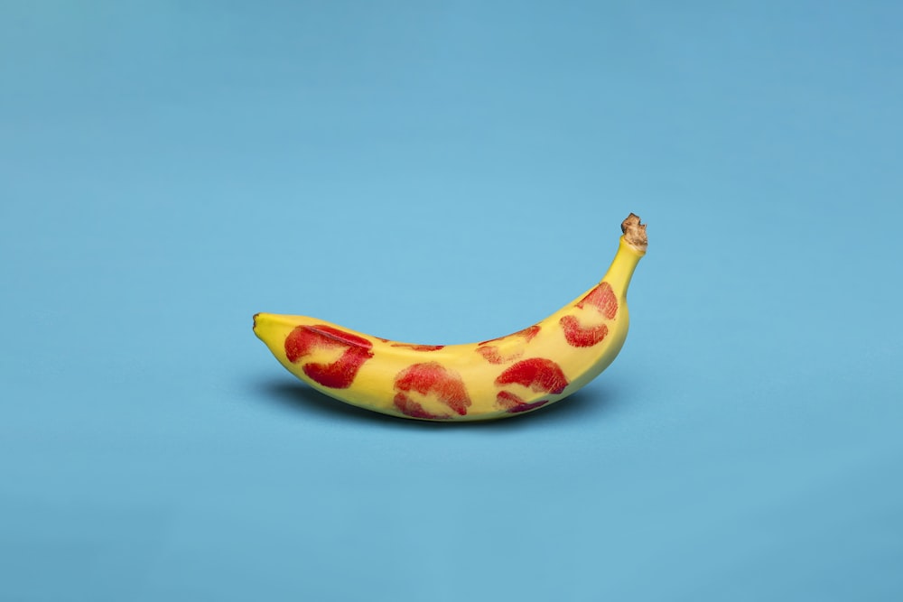 yellow banana fruit on blue surface