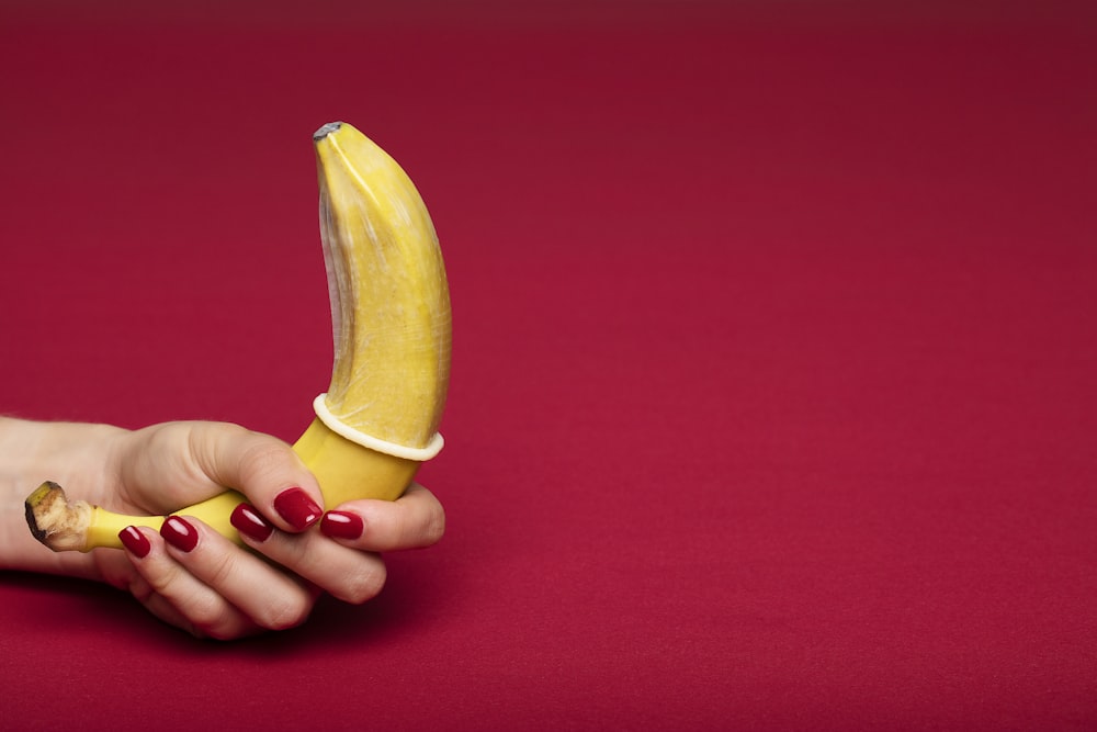 person holding yellow banana fruit