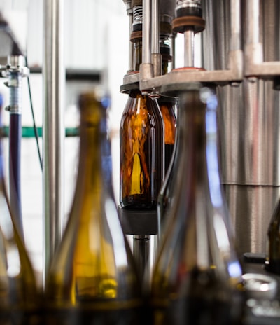 selective focus photography of bottles on rack