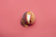 sliced apple fruit on red surface