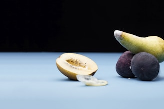 sliced lemon and black round fruit