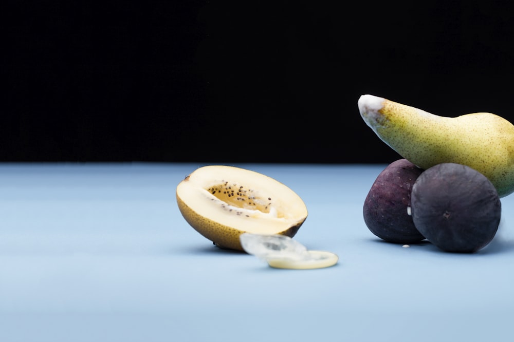 sliced lemon and black round fruit