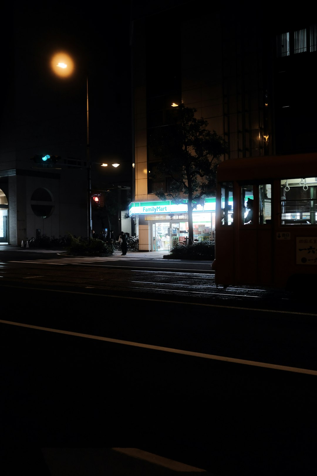 black and white bus on road during night time