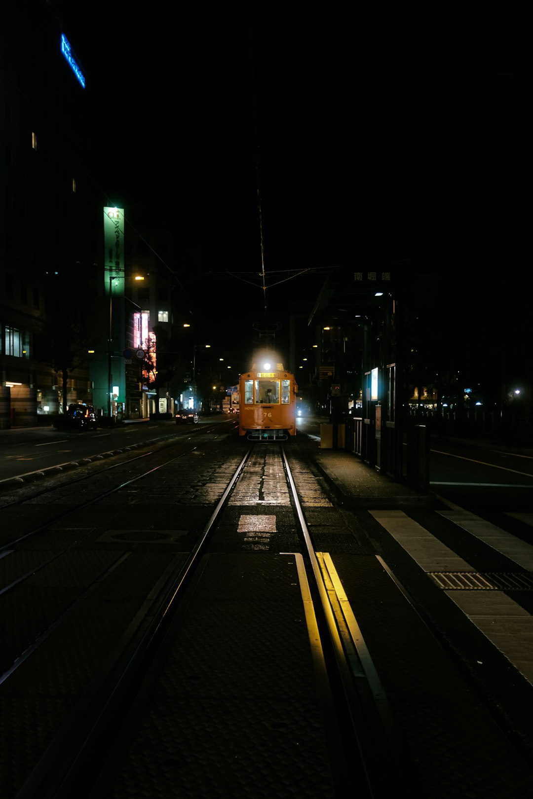 yellow train on rail road during night time